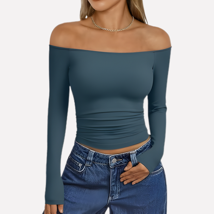 Fashionable women's off-shoulder long sleeve top. A stylish blouse ideal for various everyday occasions.