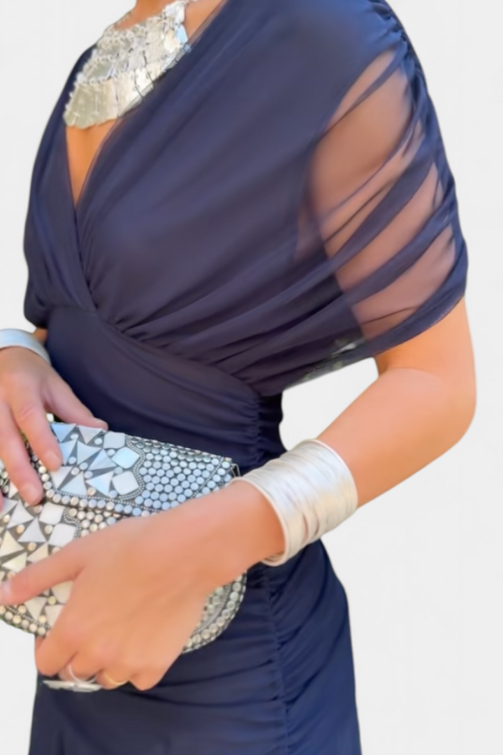Women's colorful off-shoulder maxi dress, an elegant evening gown, perfect for formal party attire.