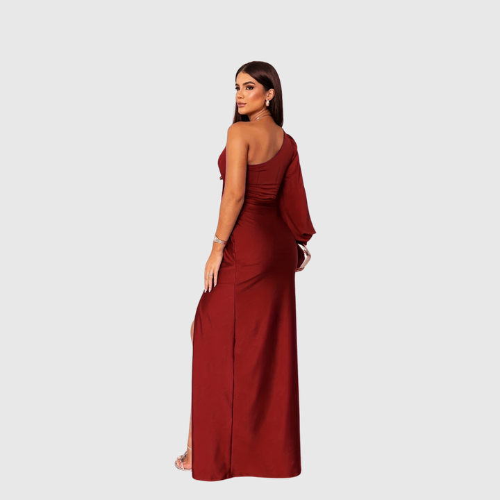 Full-length women's party wear. One-shoulder design, elegant silhouette & high slit. Perfect for formal evenings.