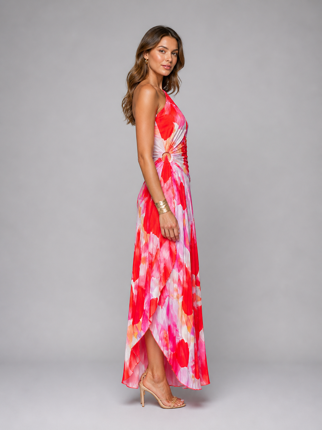 Flowy women's one-shoulder floral maxi dress with a graceful pleated skirt, perfect for elegant events.