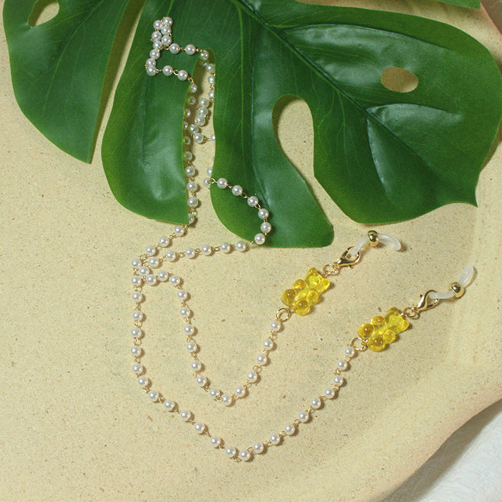 Sophisticated pearl chain for reading glasses, a timeless fashion accessory.