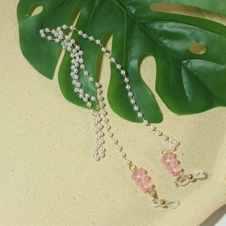 Stylish pearl glasses accessory for women, secure and fashionable.