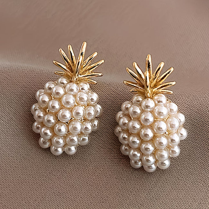 Women's elegant pearl pineapple drop earrings, a charming tropical accessory.