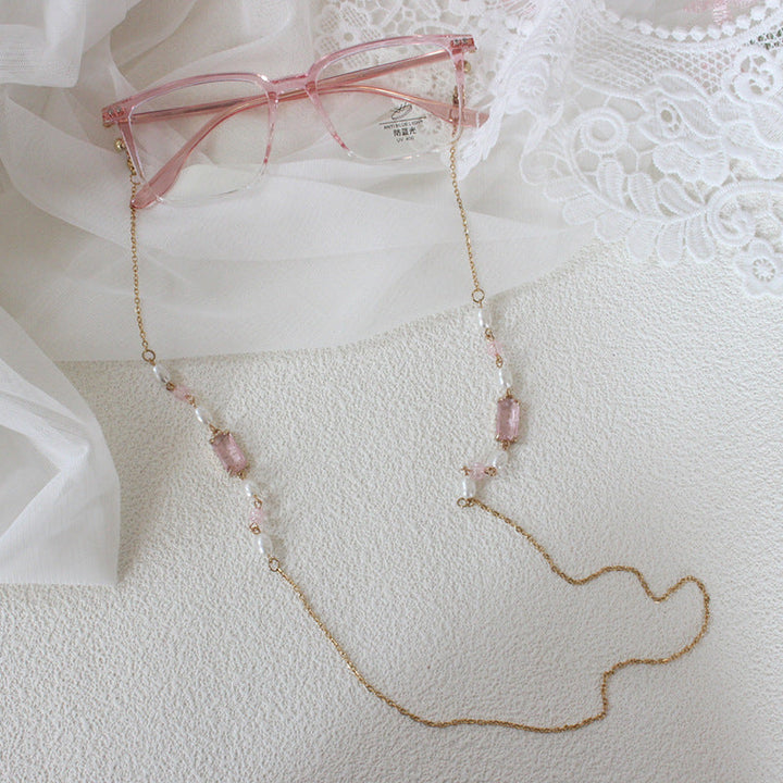 Women's elegant pink pearl necklace, perfect for special occasions & fashion. A sophisticated accessory.