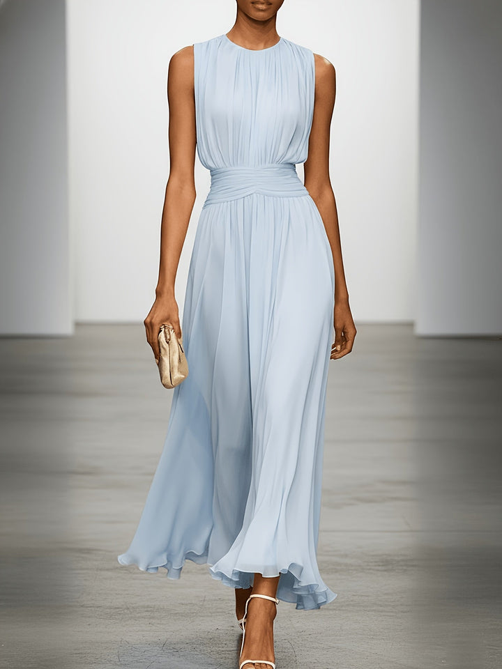 Flowy sleeveless maxi dress for women, featuring a pleated skirt & flattering ruched waist, ideal for parties.