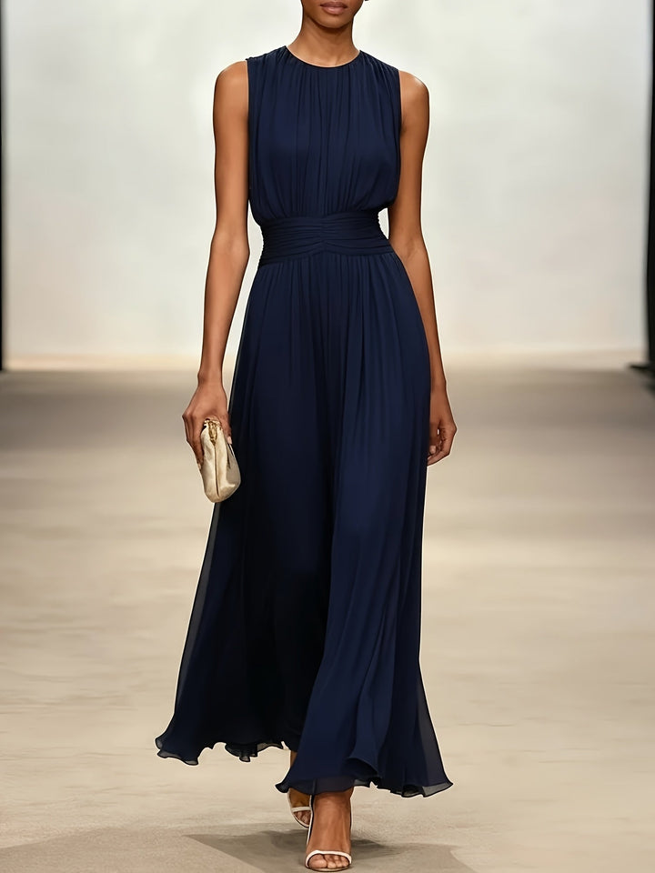 Formal women's long pleated dress with a stylish ruched waist, suitable as a wedding guest or evening gown.