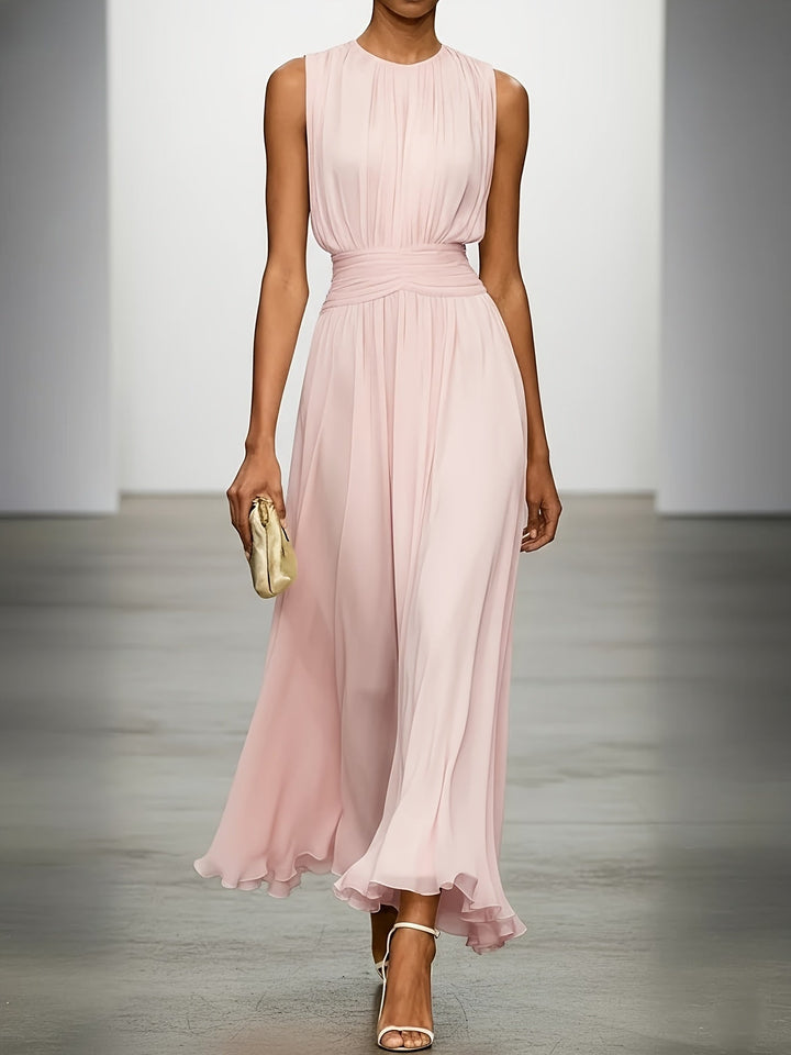 Sleeveless women's maxi wedding guest dress, featuring delicate pleats & a chic ruched waist for a refined look.