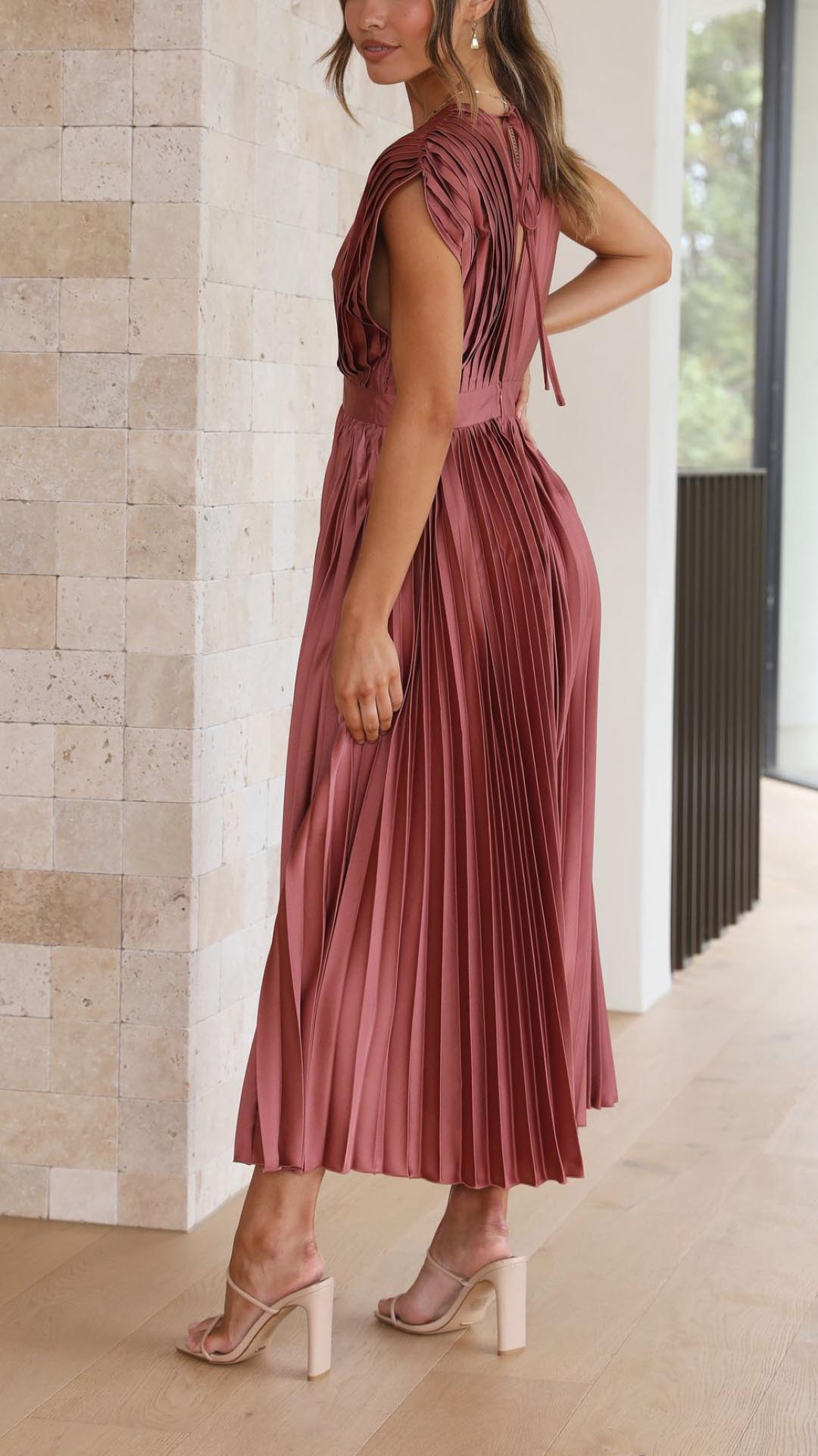 Sophisticated wedding guest midi dress with elegant pleats and a flattering V-neck.