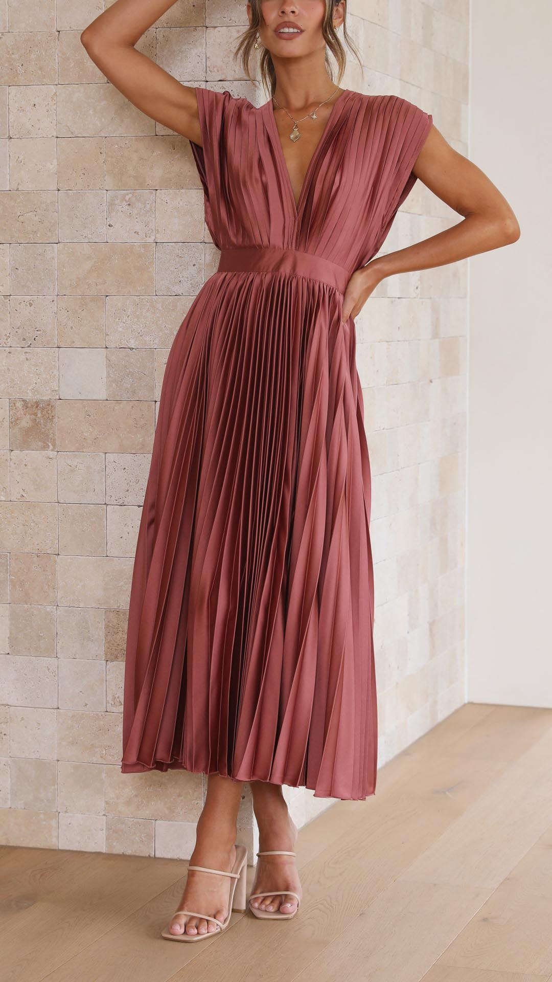 Comfortable & elegant V-neck pleated midi dress for women, offering a flattering silhouette.