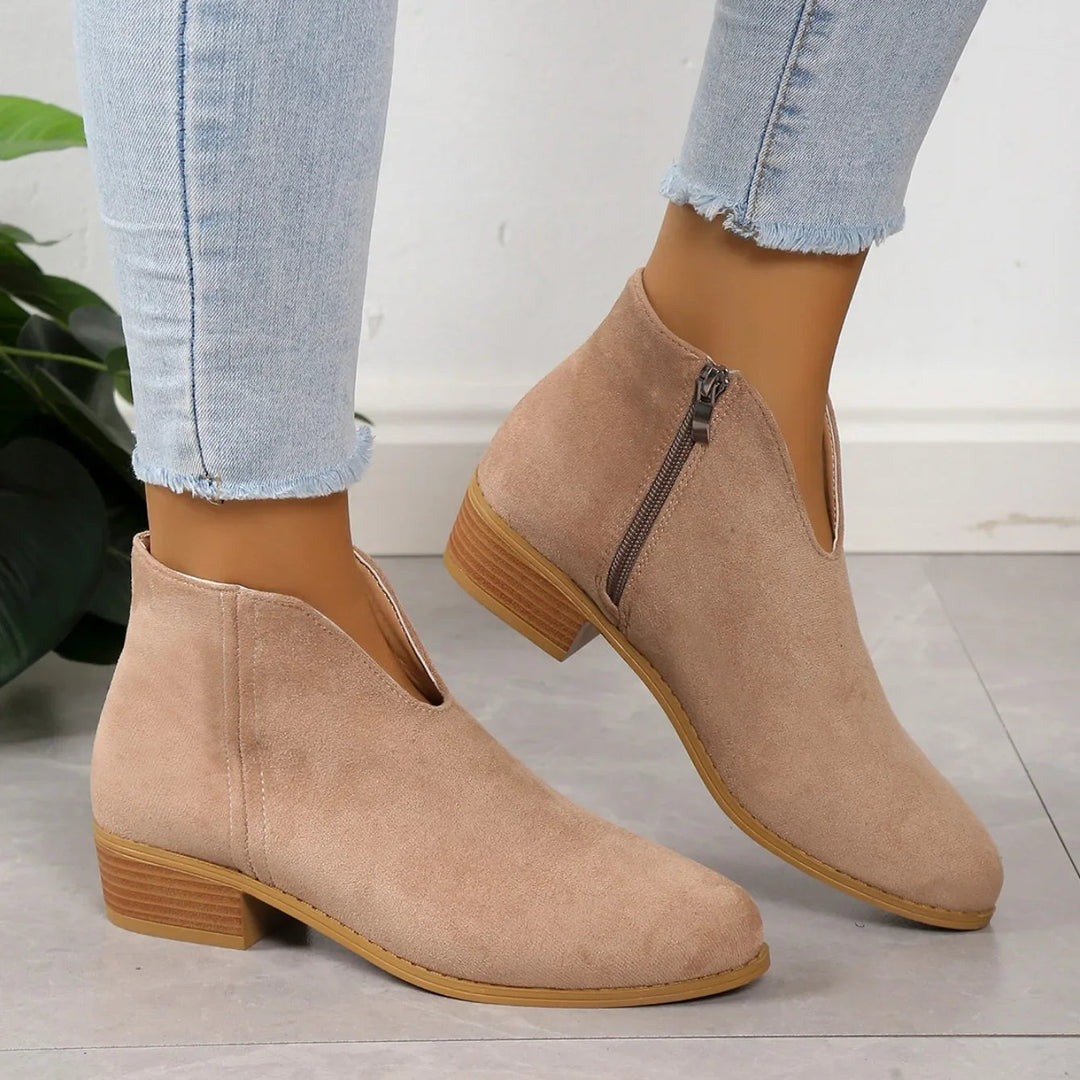 Modern women's pointed toe ankle boots, elegant square heel design, ideal for chic fashion.