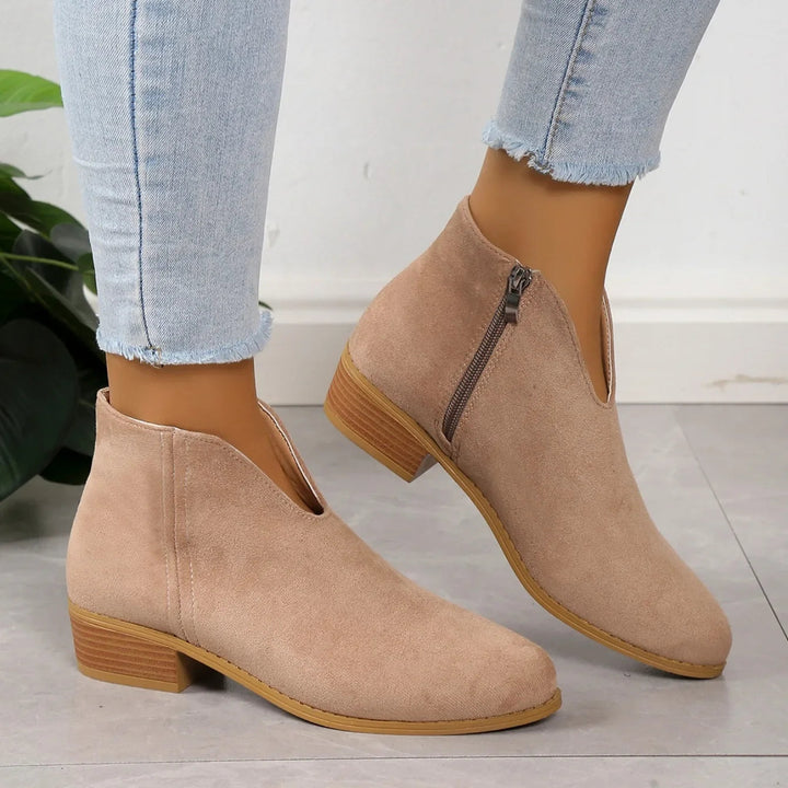 Modern women's pointed toe ankle boots, elegant square heel design, ideal for chic fashion.