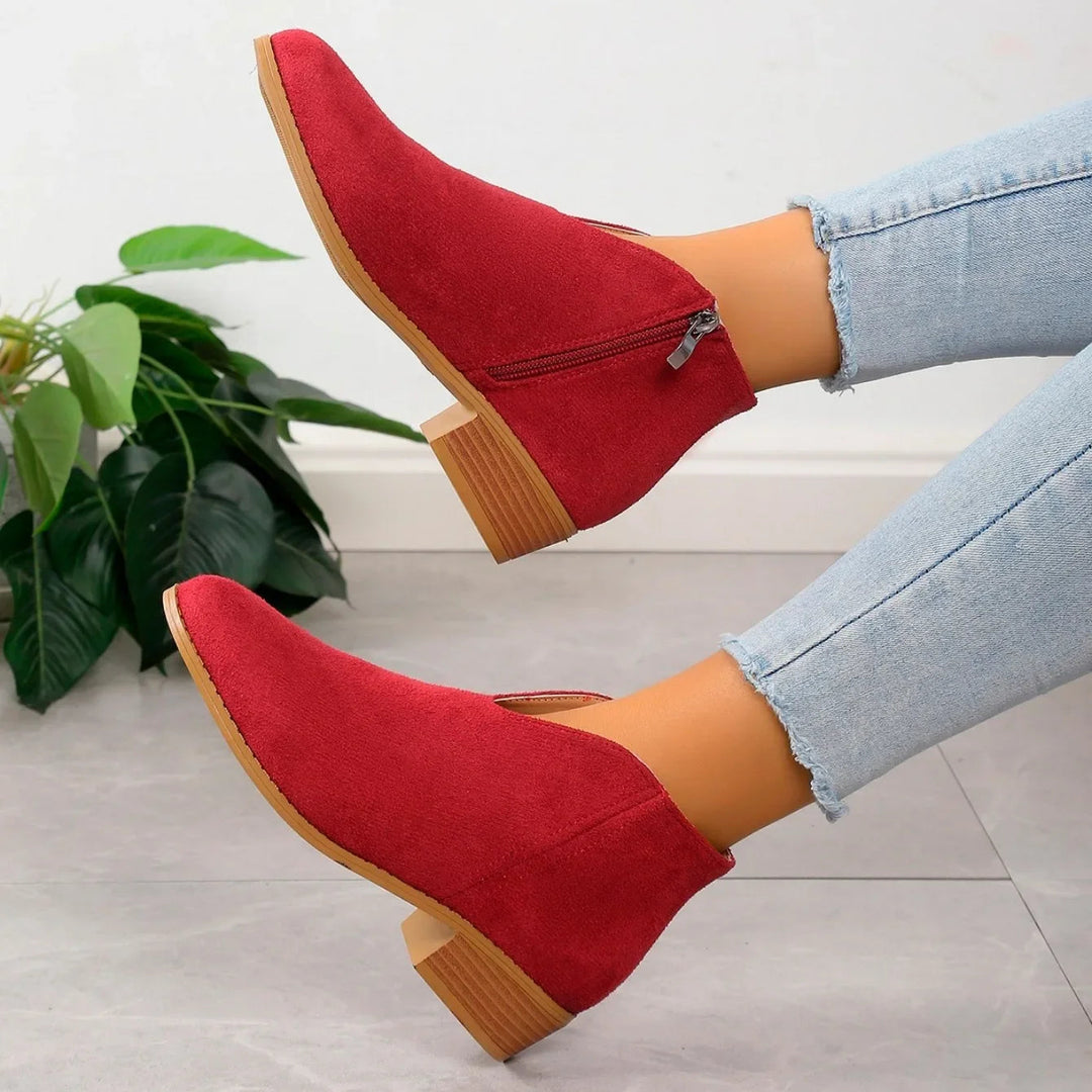 Bold red elegant pointed toe ankle boots, women's slip-on style, comfortable square heel.