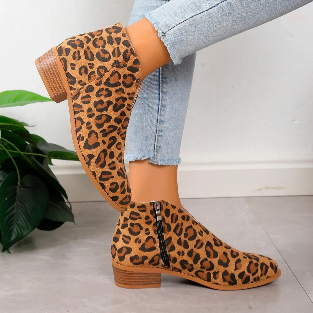 Chic red pointed toe ankle boots for women, elegant square heel design, slip-on style.