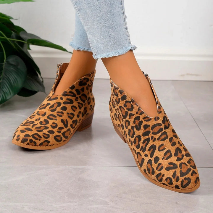 Classic black pointed toe ankle boots for women, elegant square heel, perfect for fall/winter.
