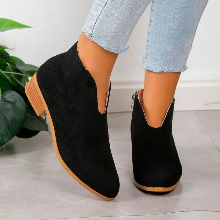 Elegant women's pointed toe ankle boots, comfortable square heel, slip-on for easy wear.