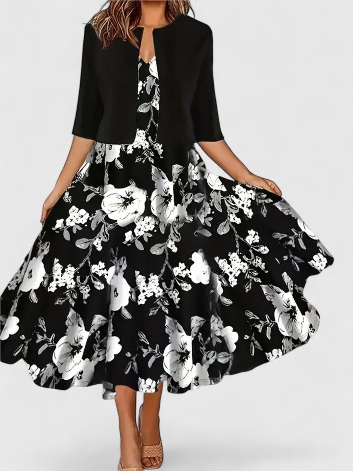 Stylish women's printed A-line midi dress, featuring three-quarter sleeves; ideal for spring & summer fashion.