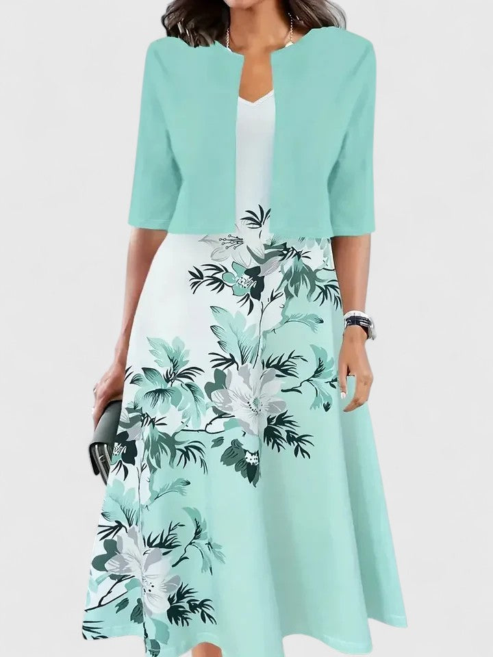 Chic women's printed A-line midi dress showcasing three-quarter sleeves; a fashionable choice for any event.