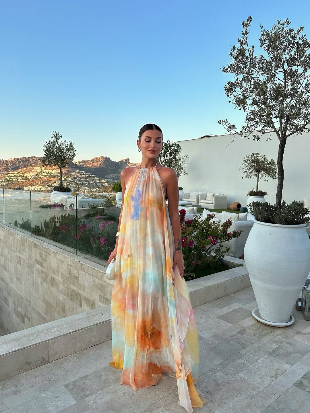 Chic women's printed halter maxi dress, ideal for effortless summer style, vacation, or elegant beach attire.