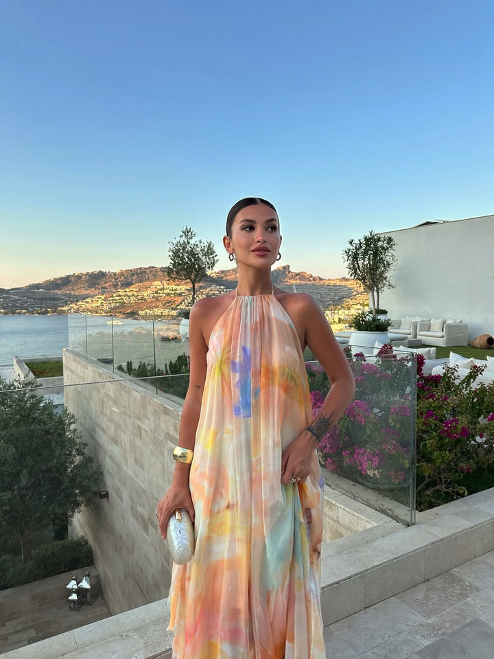 Comfortable women's printed halter maxi dress for summer, offering elegant style and vacation-ready casual chic.