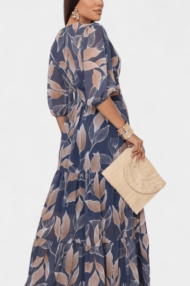 Full-length women's printed maxi dress, showcasing an elegant V-neck and a comfortable, flowing design.