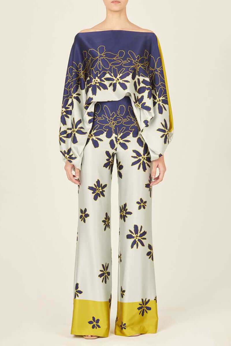 Two-piece women's off-shoulder long sleeve printed skirt set.