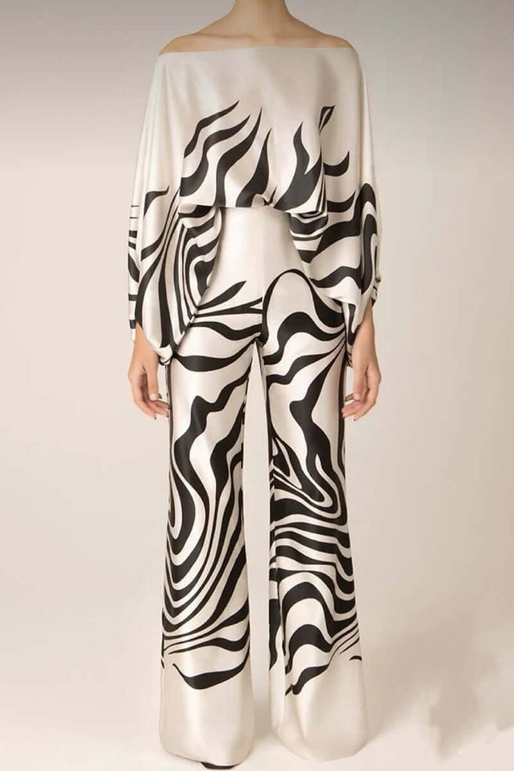 Versatile women's printed off-shoulder long sleeve top & skirt set.
