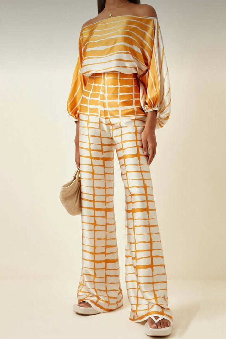 Chic women's casual printed off-shoulder long sleeve two-piece skirt set.