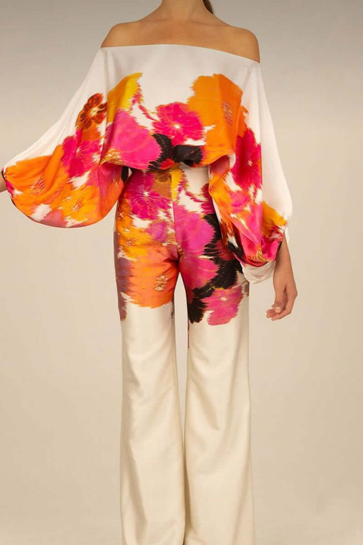Printed long sleeve off-shoulder top and skirt set for women, elegant style.