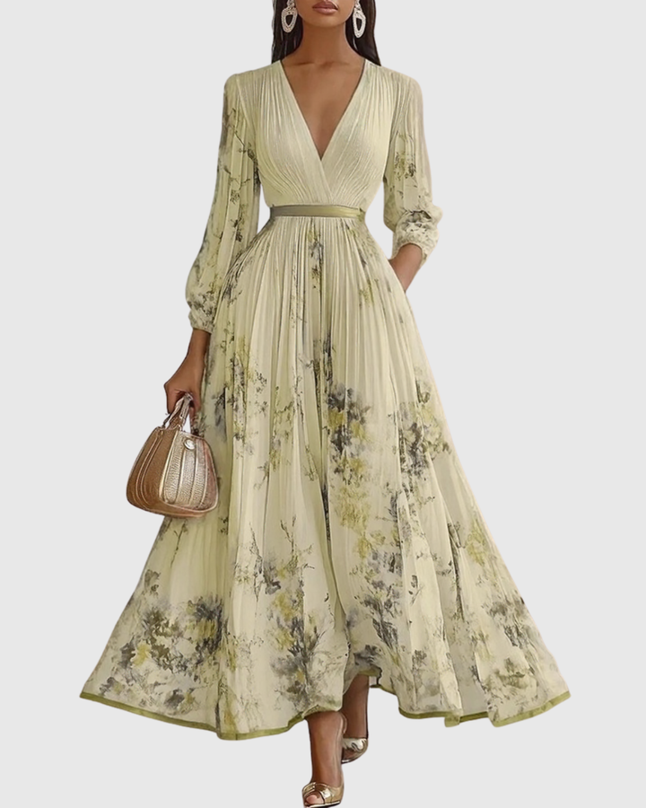 Flowy women's printed pleated maxi dress with deep V neck. Stylish for summer events & special occasions.