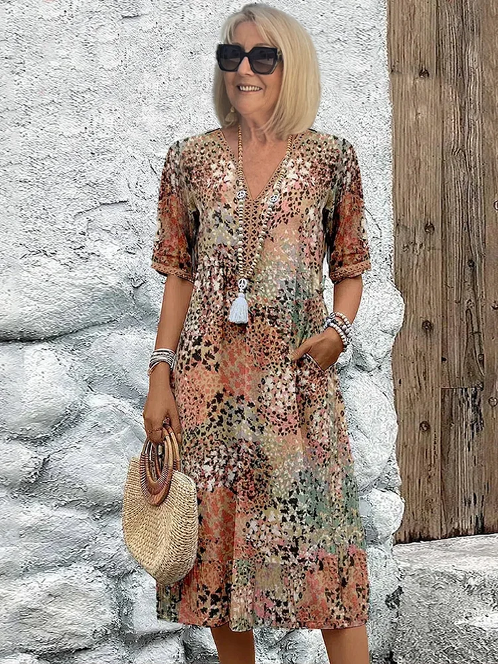 Flowy A-line midi dress for women, with a chic print and V-neck, offering comfortable and elegant summer style.
