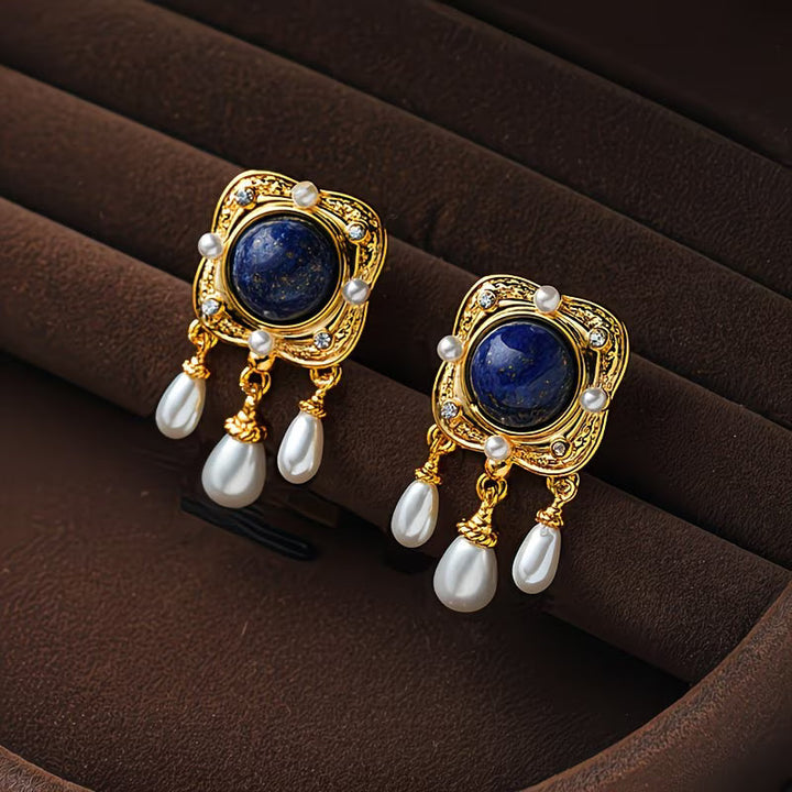 Women's elegant royal blue pearl chandelier earrings, perfect statement jewelry accessory.