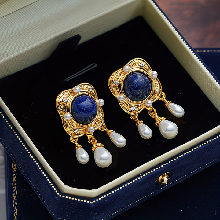 Stunning royal blue pearl drop chandelier earrings for women, a luxurious jewelry accessory.