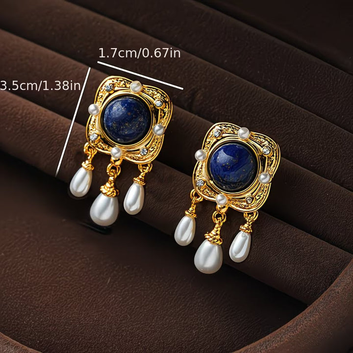 Fashionable royal blue pearl chandelier earrings for women, a glamorous statement piece.