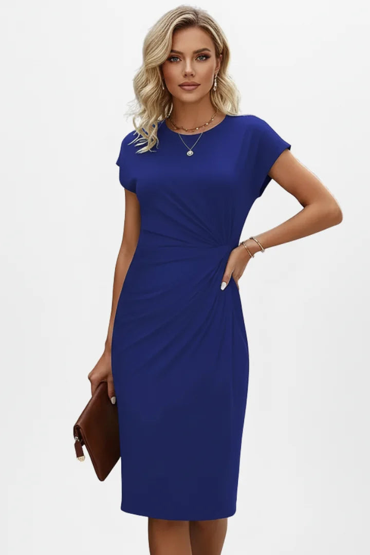 Elegant round neck midi dress with ruched waist & cap sleeves. A versatile wardrobe essential for women.