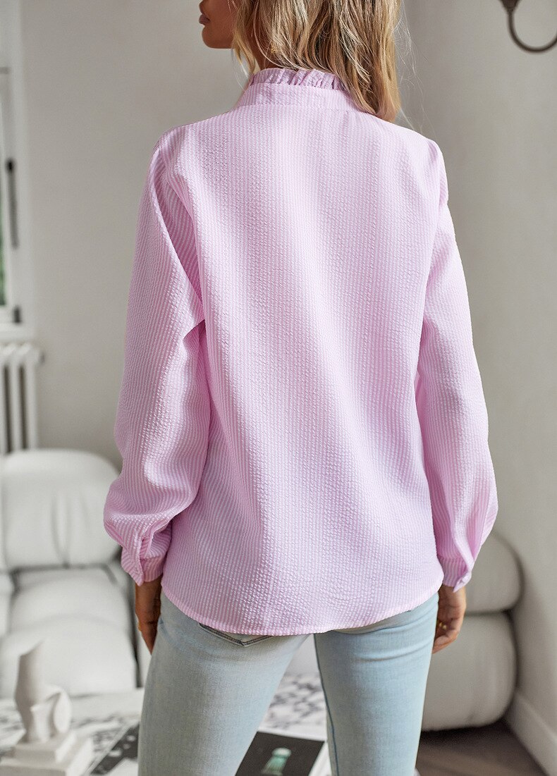 Versatile women's elegant ruffle top, a long sleeve shirt perfect for both casual and formal styles.