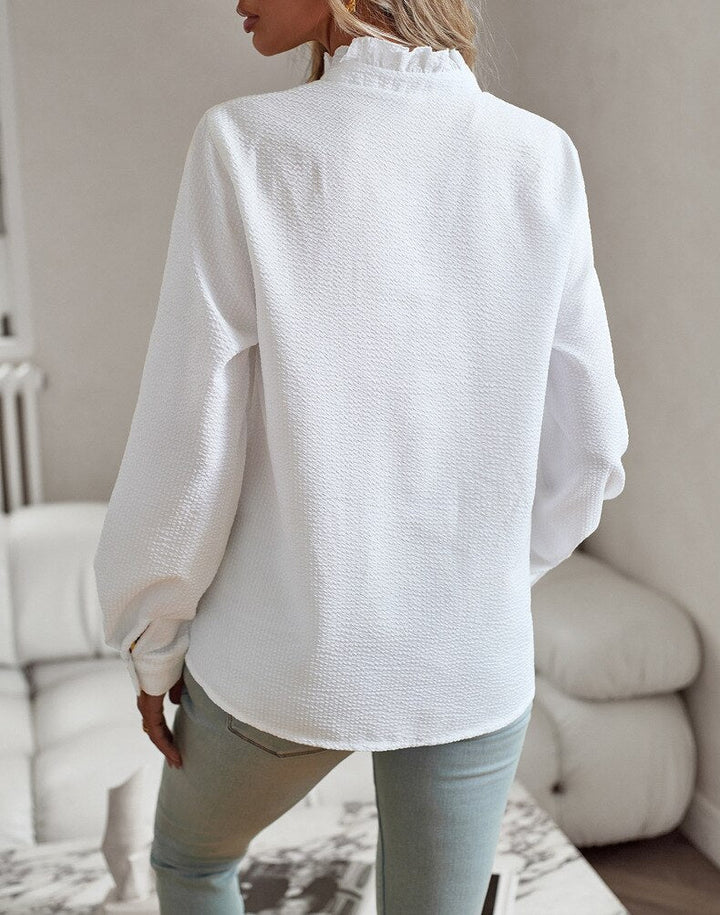 Chic long sleeve women's top with elegant ruffles and a round neck, perfect for everyday fashion.