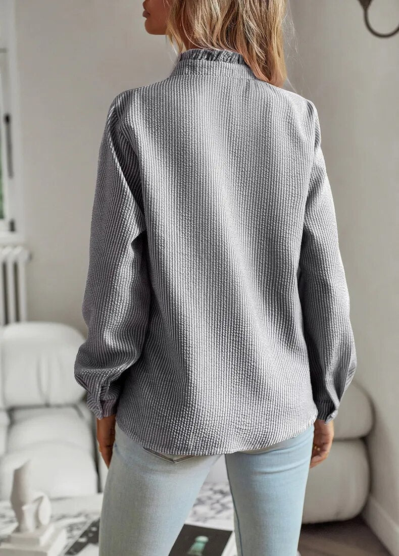 Casual yet chic women's ruffle blouse, a versatile long sleeve top for everyday elegant style.