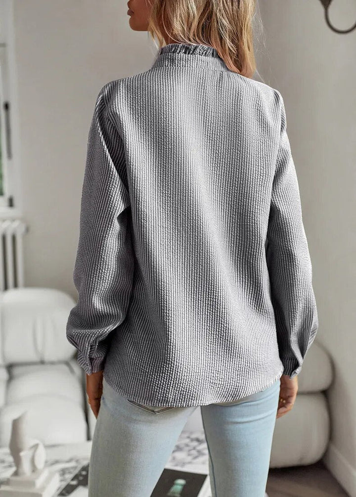 Casual yet chic women's ruffle blouse, a versatile long sleeve top for everyday elegant style.