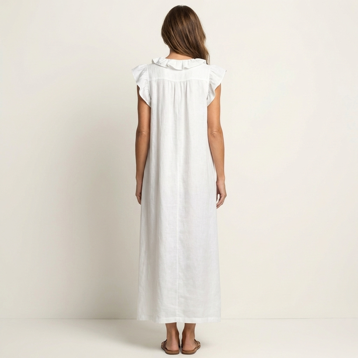 Feminine flowing maxi dress with an elegant V-neck and charming ruffles.