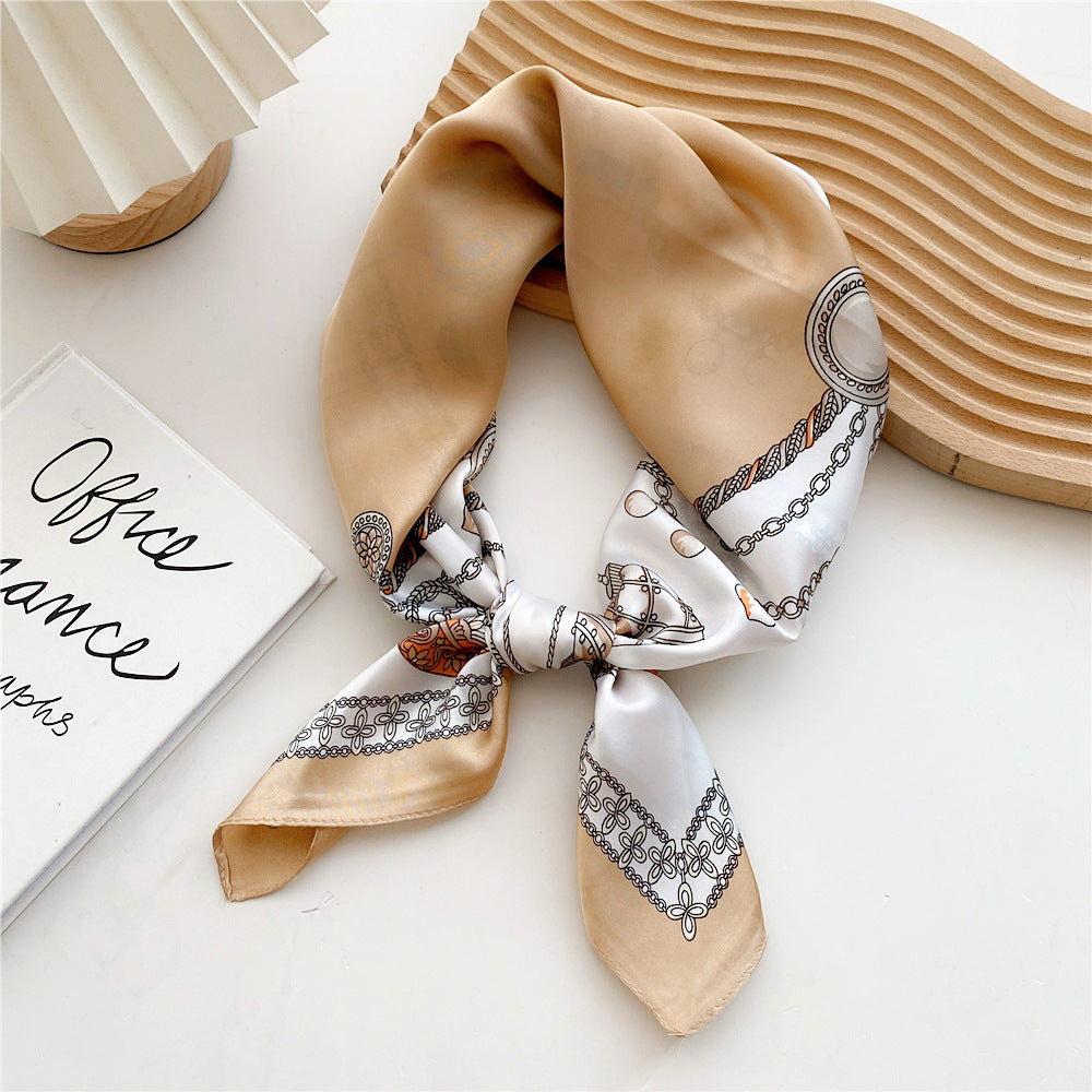 Women's elegant satin leopard print scarf, a versatile fashion accessory.