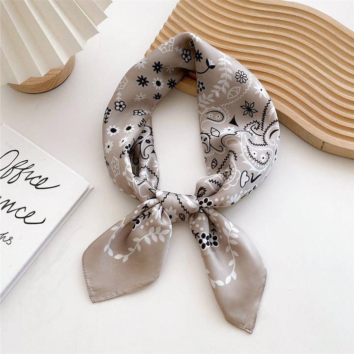 Women's fashion-forward satin leopard print scarf, perfect for head or neck styling.