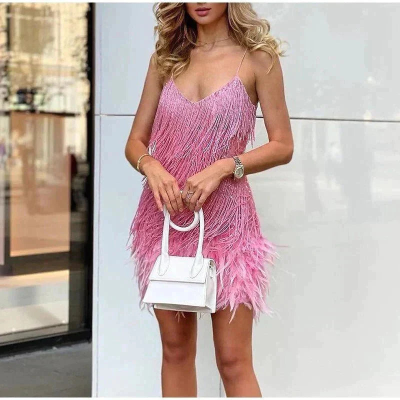 Sparkling sequin spaghetti strap women's cocktail dress, a fitted formal party gown.