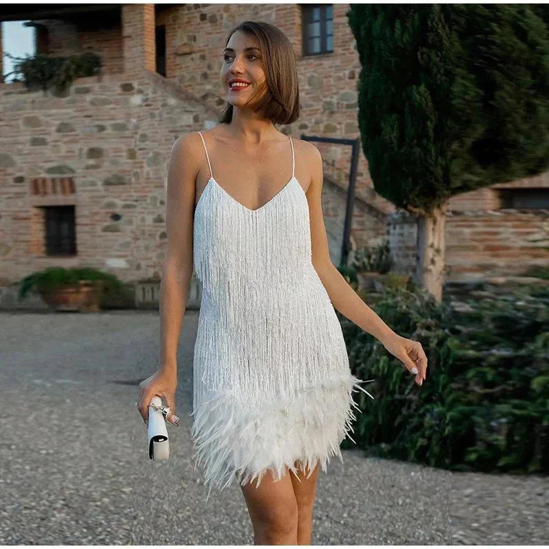 Shimmering women's sequin spaghetti strap party dress, elegant and fitted for evening events.