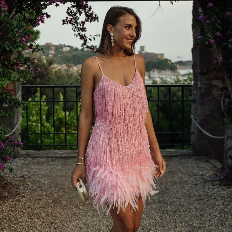 Stylish women's sequin spaghetti strap cocktail dress, perfect elegant fitted party wear.