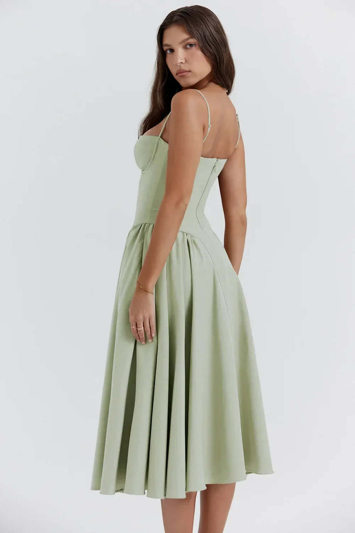 Women's elegant sleeveless corset midi dress. Flattering fitted design for chic parties.