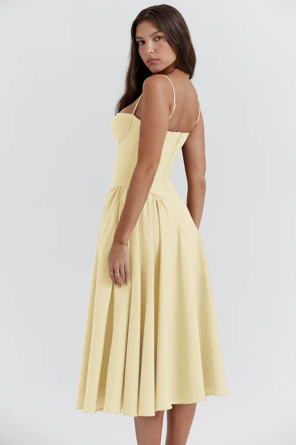 Summer-ready women's sleeveless midi dress. Corset fit, flattering & chic for any gathering.