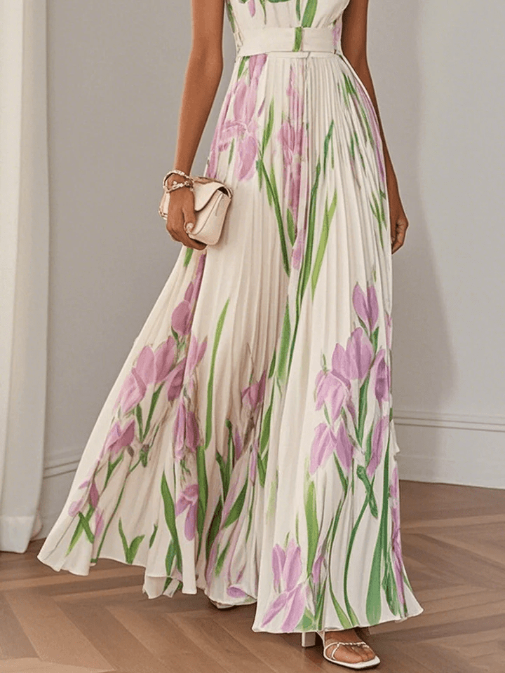 Vibrant floral print sleeveless maxi dress for women, featuring a chic square neck and pleated details, ideal for vacations.