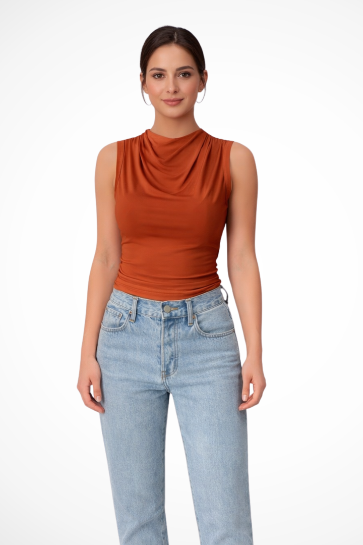 Chic women's peplum top, sleeveless, with an elegant draped neckline. A versatile workwear & casual blouse.