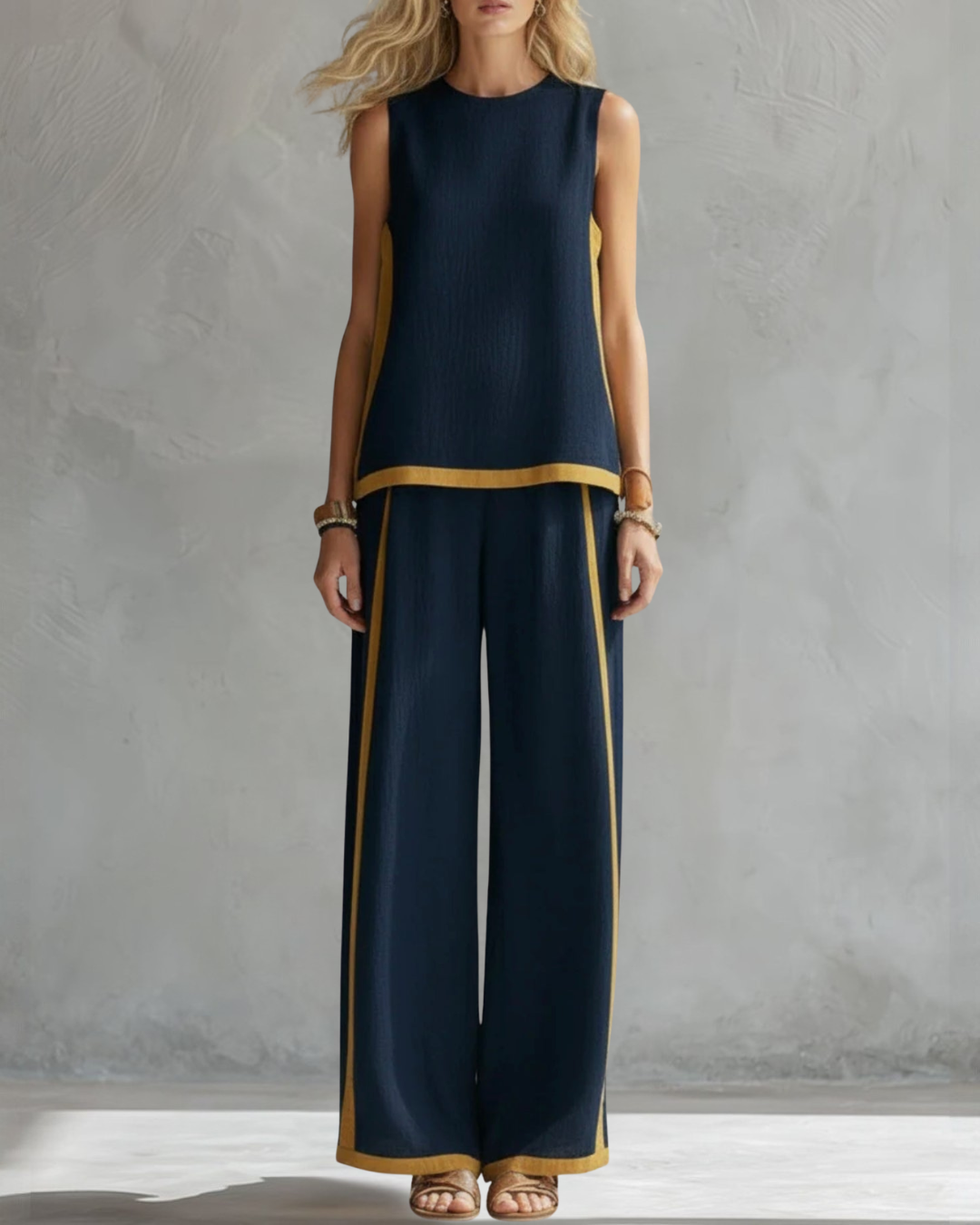 Versatile women's set: elegant sleeveless top & wide-leg pants for day-to-night fashion.