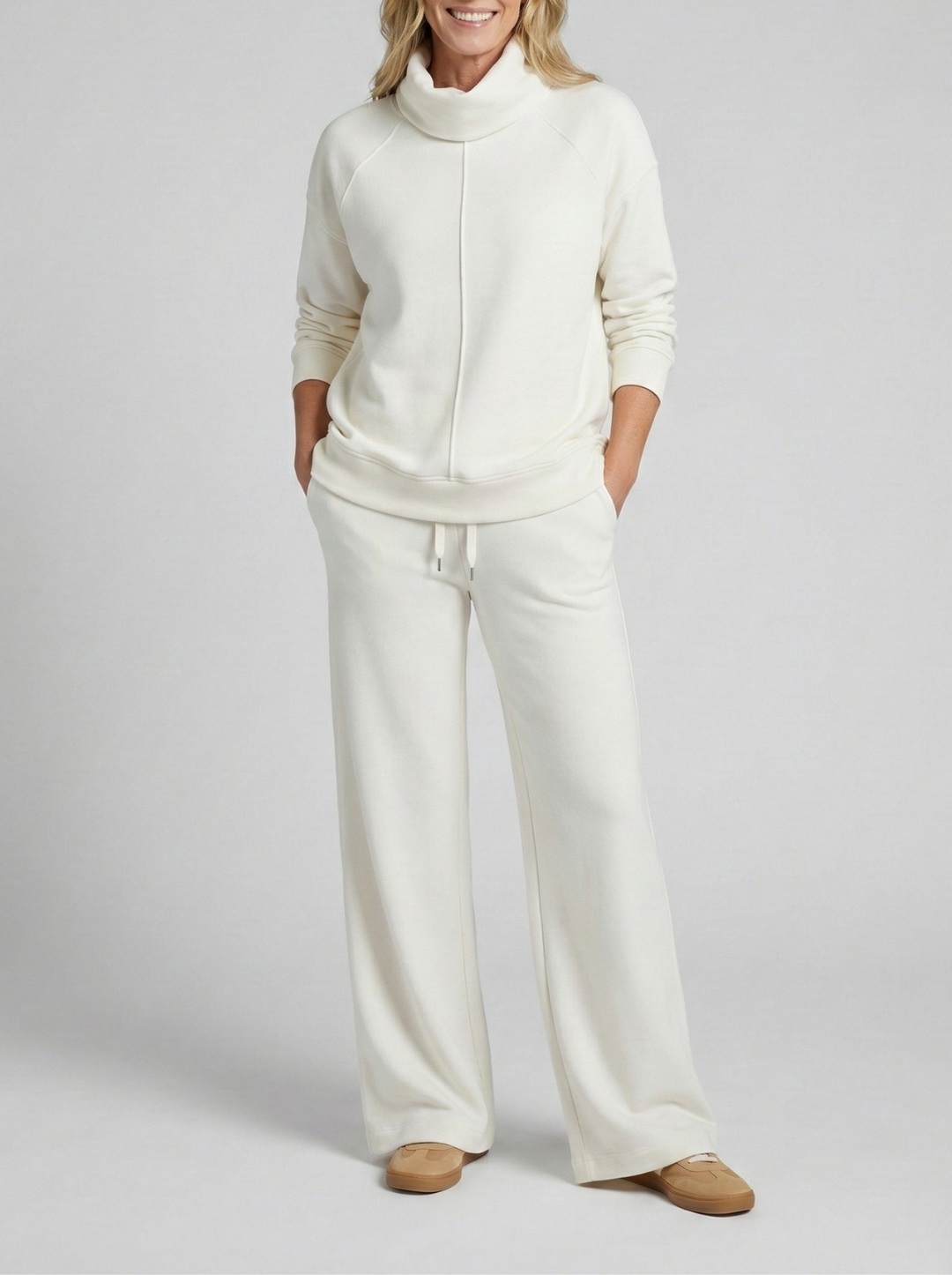 Elegant women's two-piece matching set, soft fabric pullover & pants for comfortable and relaxed everyday wear.
